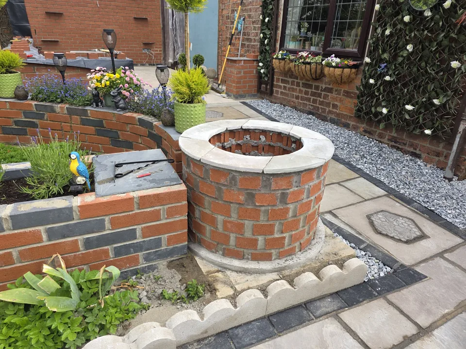 Curved brick garden walls and a circular brick feature