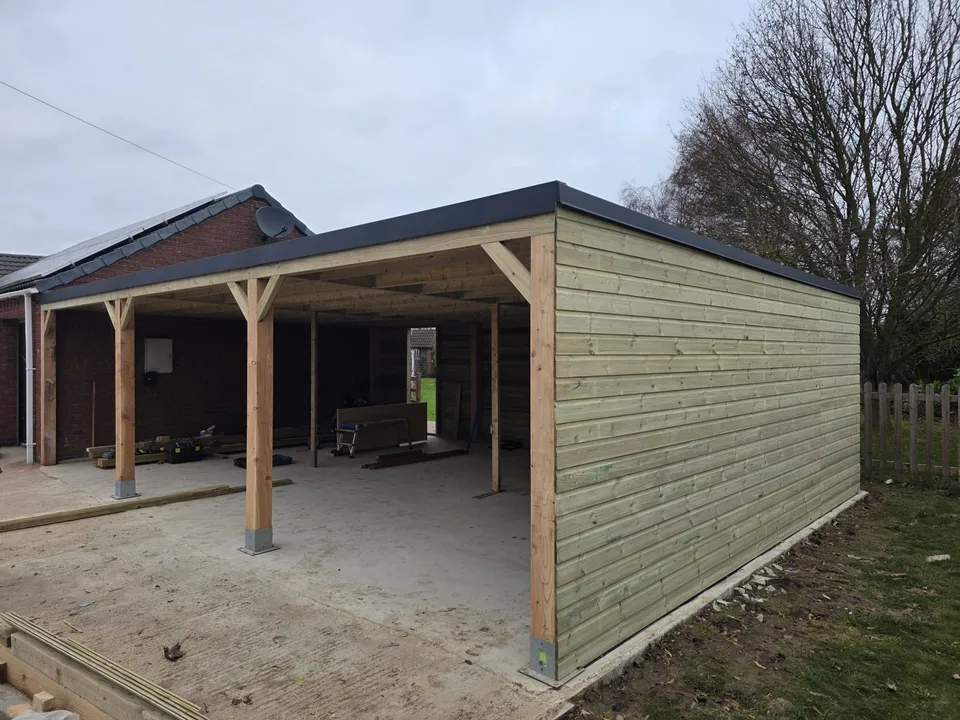 Timber-clad garden structure under construction